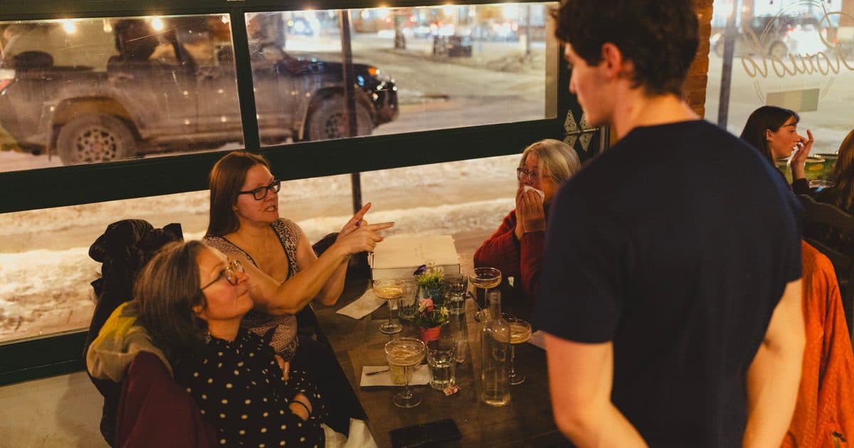 Guests gathered around a table at a Prosper Events evening
