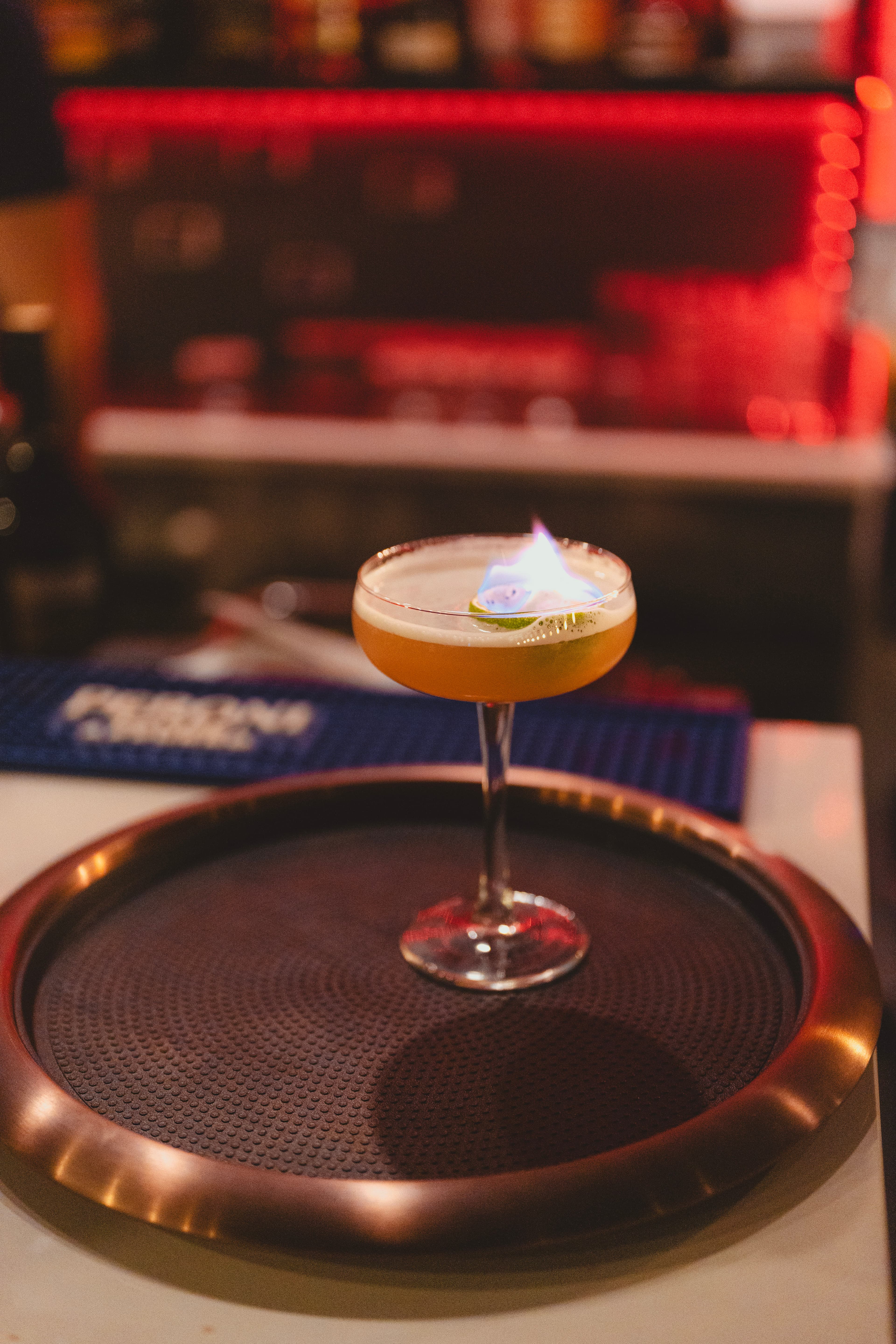 Cocktails being served in an intimate bar setting